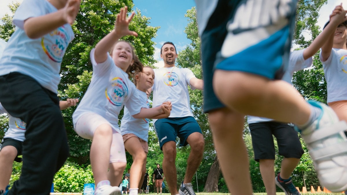 a group of people playing a game of frisbee